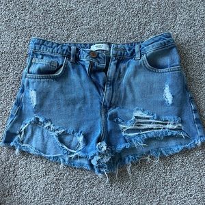 Destroyed denim shorts